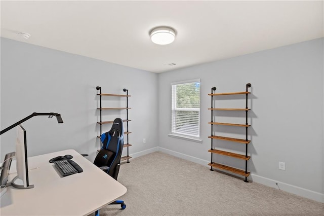 office space with carpet and baseboards