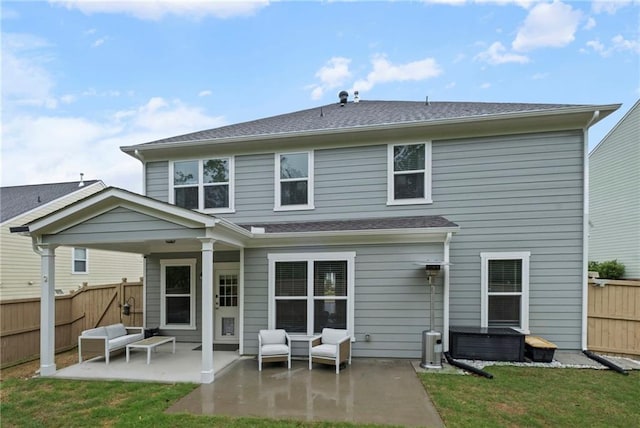 back of house with a patio area, a jacuzzi, outdoor lounge area, and roof with shingles