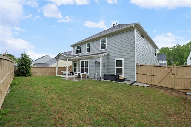 back of property featuring a patio area and a gate
