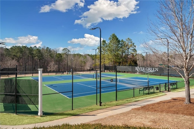 view of tennis court with fence