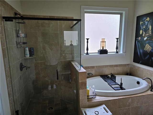 bathroom with separate shower and tub