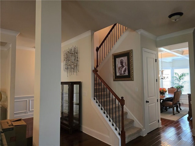 stairs featuring hardwood / wood-style flooring, french doors, and crown molding