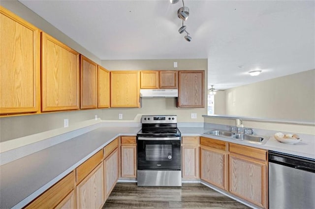 kitchen with sink, stainless steel appliances, ceiling fan, and light brown cabinets