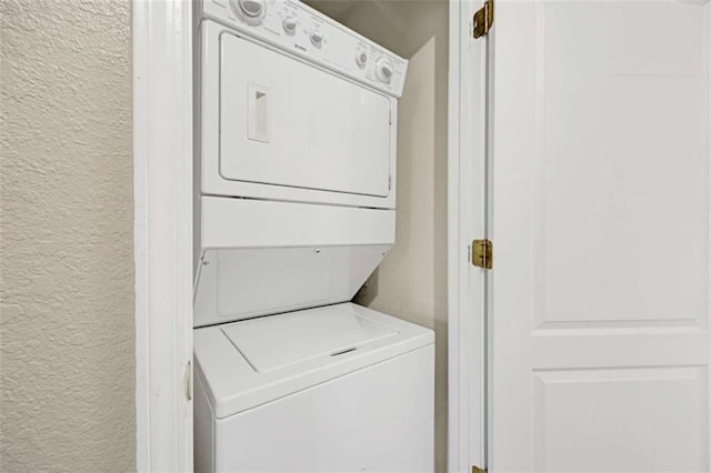 laundry room featuring stacked washing maching and dryer