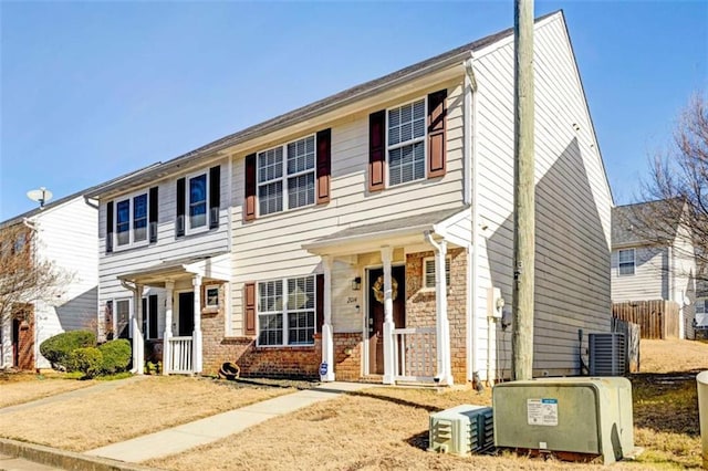 colonial inspired home with central air condition unit