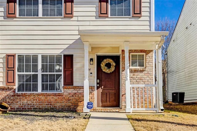 doorway to property with central AC