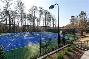 view of sport court with fence