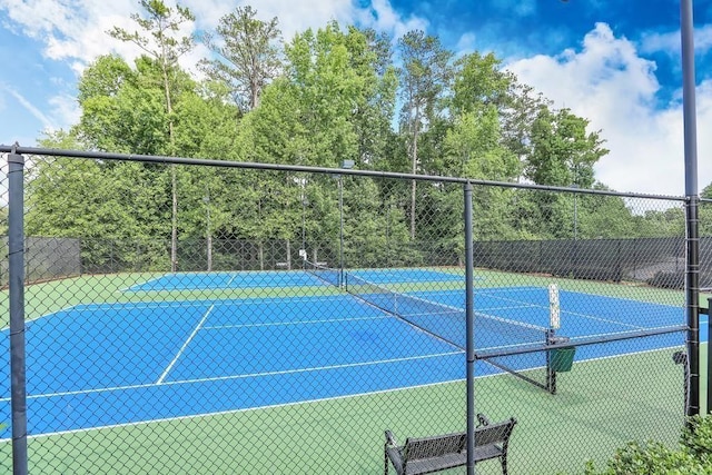 view of sport court with fence