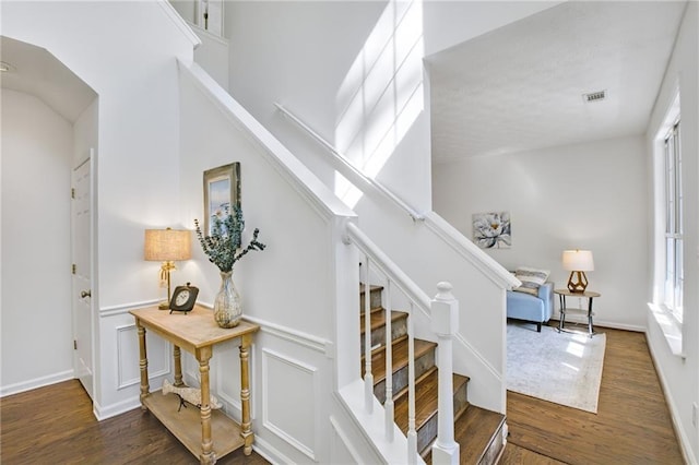 staircase featuring wood-type flooring