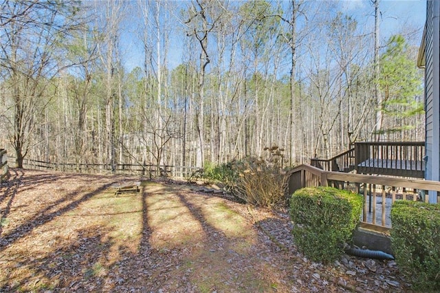 view of yard featuring a wooden deck