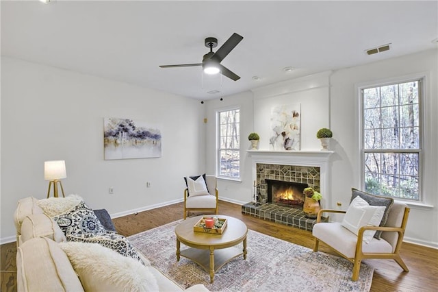 living room featuring hardwood / wood-style flooring and ceiling fan