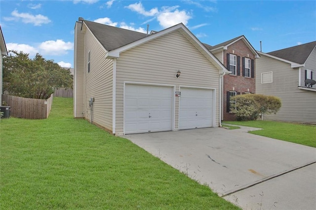 exterior space featuring a garage, a front lawn, and central AC