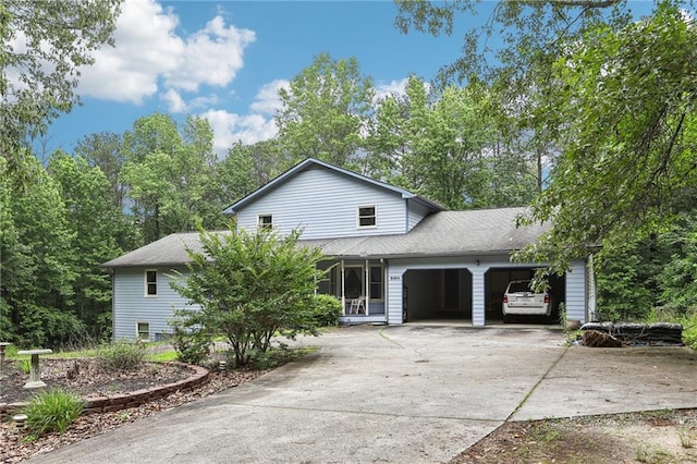8464 Pleasant Hill Rd, Lithonia, GA 30058 - view of front of home featuring a garage, concrete driveway, and a shingled roof