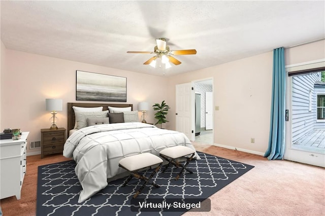 8464 Pleasant Hill Rd, Lithonia, GA 30058 - bedroom with access to exterior, light carpet, baseboards, and a ceiling fan