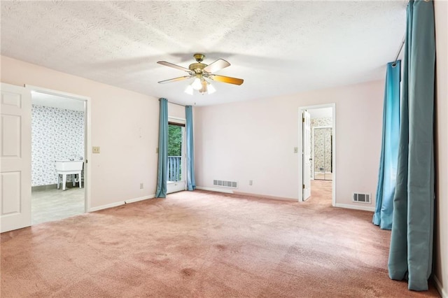 8464 Pleasant Hill Rd, Lithonia, GA 30058 - carpeted spare room featuring ceiling fan, baseboards, and a textured ceiling