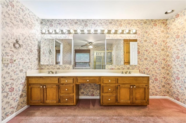 8464 Pleasant Hill Rd, Lithonia, GA 30058 - bathroom featuring wallpapered walls, baseboards, double vanity, a ceiling fan, and a shower with door