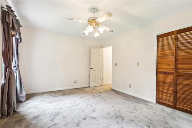 8464 Pleasant Hill Rd, Lithonia, GA 30058 - unfurnished bedroom with a closet, carpet flooring, baseboards, and a ceiling fan