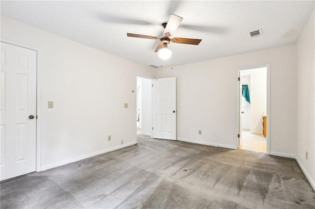 8464 Pleasant Hill Rd, Lithonia, GA 30058 - unfurnished bedroom with carpet flooring, baseboards, ensuite bathroom, and ceiling fan