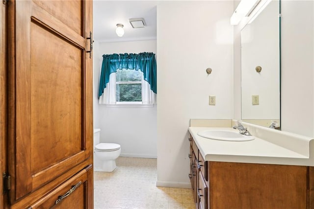8464 Pleasant Hill Rd, Lithonia, GA 30058 - bathroom with vanity, toilet, baseboards, and tile patterned floors