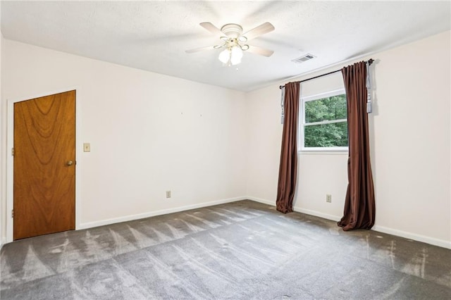 8464 Pleasant Hill Rd, Lithonia, GA 30058 - carpeted spare room with a ceiling fan, baseboards, and a textured ceiling