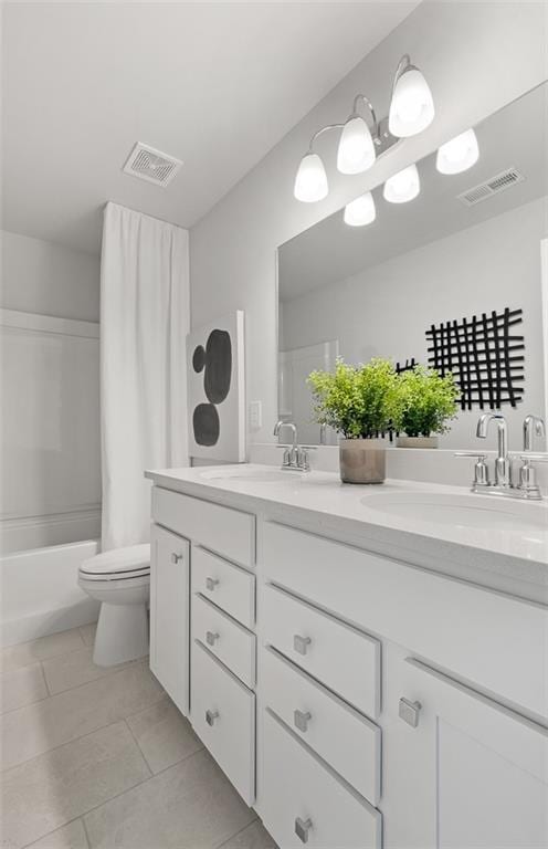 full bathroom with tile patterned flooring, toilet, vanity, and shower / tub combo with curtain