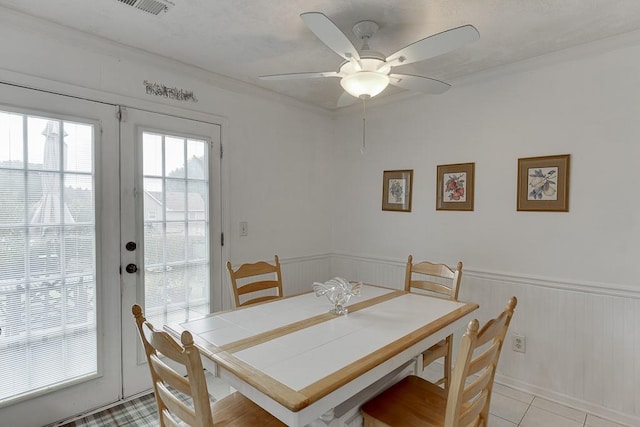 dining room with french doors, ceiling fan, and light tile patterned floors