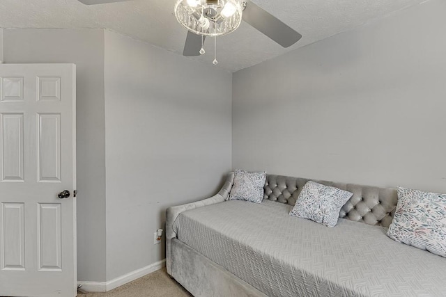 carpeted bedroom featuring a textured ceiling