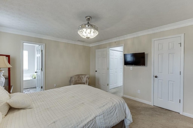 carpeted bedroom featuring connected bathroom, ornamental molding, and a textured ceiling