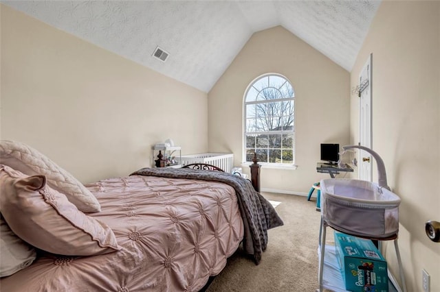 bedroom featuring visible vents, baseboards, carpet, lofted ceiling, and a textured ceiling
