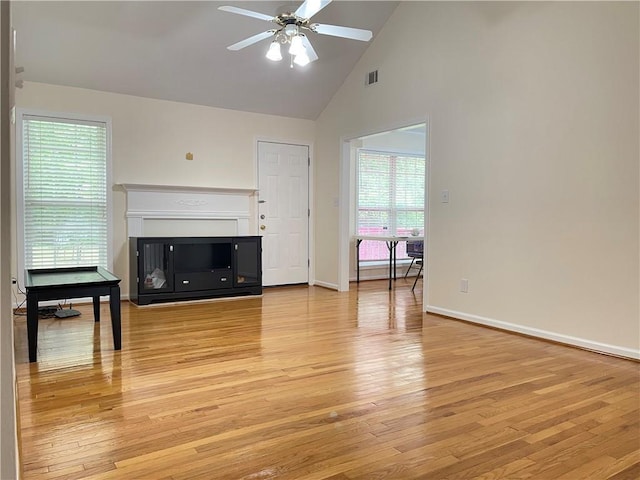 30 Buck Trl, Newnan, GA 30265 - unfurnished living room with ceiling fan, light wood-style flooring, healthy amount of natural light, and high vaulted ceiling