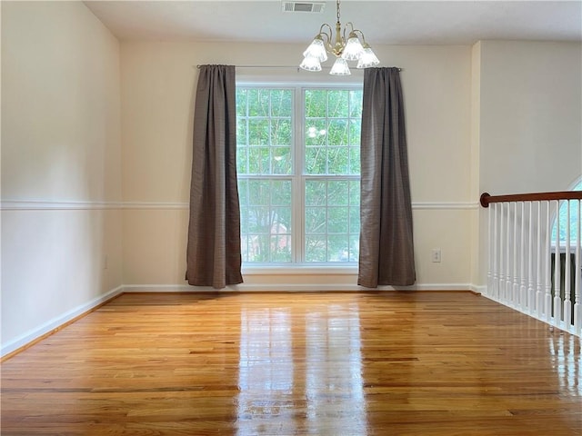 30 Buck Trl, Newnan, GA 30265 - spare room featuring wood finished floors, a chandelier, and baseboards
