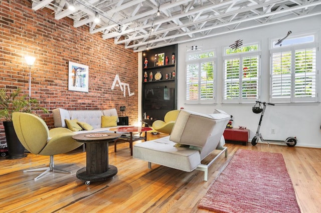 230 Bradberry St SW Unit 9, Atlanta, GA 30313 - living area with brick wall and wood-type flooring