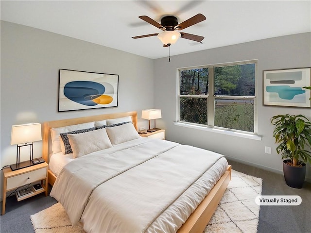 bedroom with ceiling fan and light colored carpet