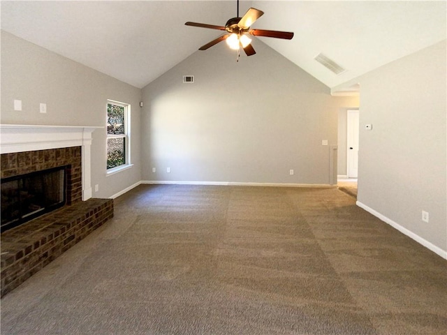 unfurnished living room featuring a ceiling fan, a brick fireplace, dark carpet, and baseboards