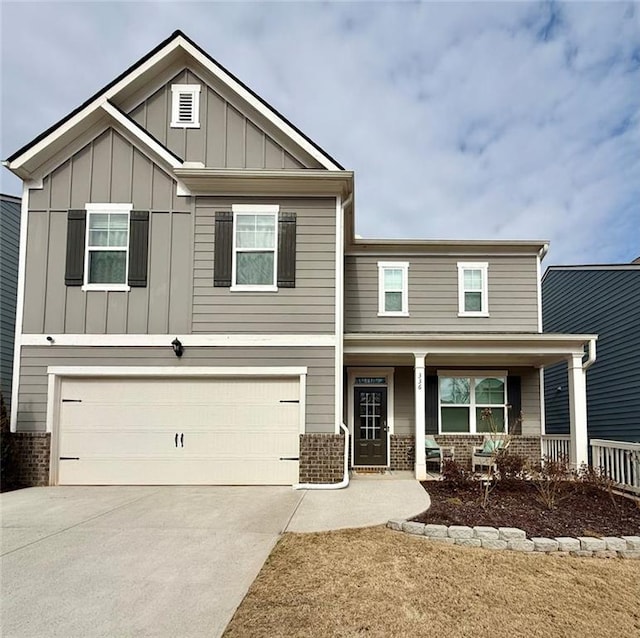 craftsman-style home featuring a garage and covered porch