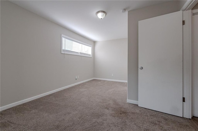 spare room featuring carpet floors