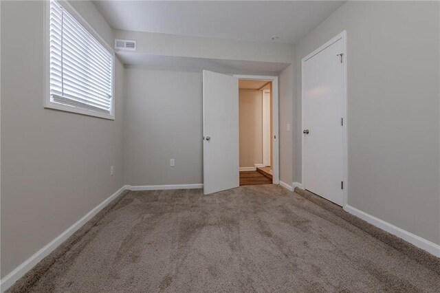 empty room featuring carpet flooring