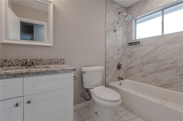 full bathroom featuring vanity, toilet, and tiled shower / bath