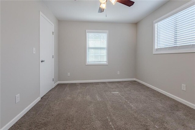 unfurnished room with carpet and ceiling fan