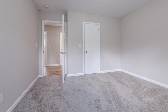 unfurnished bedroom featuring carpet flooring