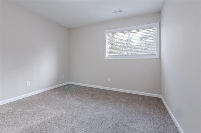 spare room featuring carpet