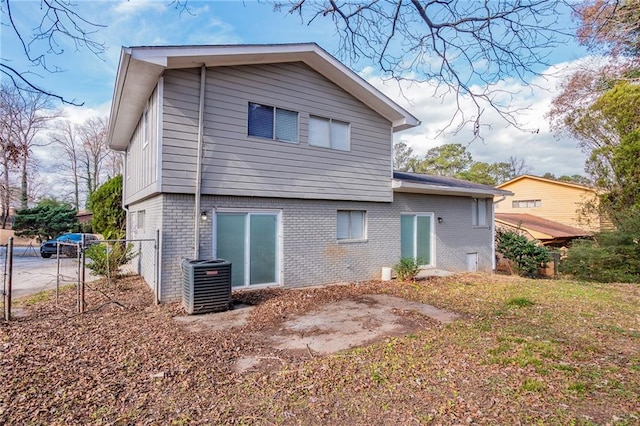 back of property featuring cooling unit