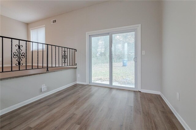 unfurnished room featuring wood-type flooring