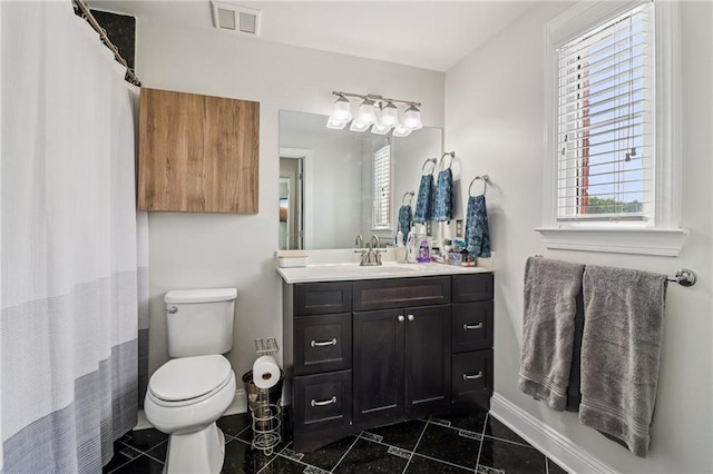 2465 Main St Unit 201, Atlanta, GA 30344 - full bath featuring vanity, plenty of natural light, and tile patterned floors