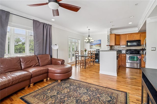 2465 Main St Unit 201, Atlanta, GA 30344 - living room with crown molding, a chandelier, light wood-style floors, ceiling fan, and recessed lighting