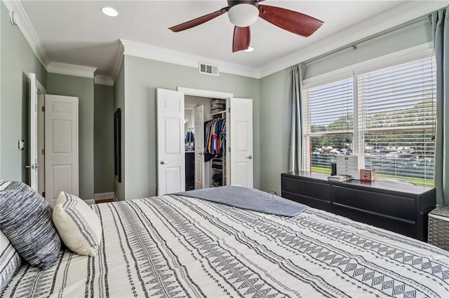2465 Main St Unit 201, Atlanta, GA 30344 - bedroom with ornamental molding, a spacious closet, recessed lighting, a closet, and a ceiling fan