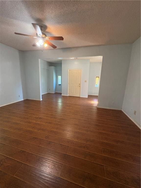 3831 Fairmont Ave, Macon, GA 31204 - empty room featuring dark wood finished floors, ceiling fan, a textured ceiling, and baseboards