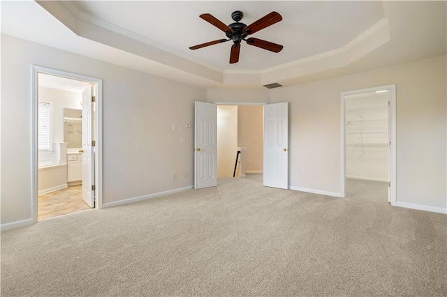 3382 Galleon Dr, Alpharetta, GA 30004 - unfurnished bedroom featuring a raised ceiling, ornamental molding, carpet floors, a walk in closet, and baseboards