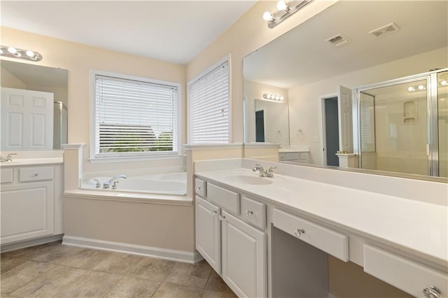 3382 Galleon Dr, Alpharetta, GA 30004 - bathroom featuring two vanities, a shower stall, a bath, and baseboards