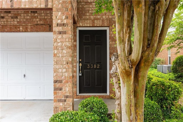 3382 Galleon Dr, Alpharetta, GA 30004 - property entrance featuring brick siding and cooling unit